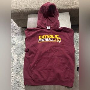 Burgundy and yellow Catholic Football hoodie. Size Medium.

#Rams